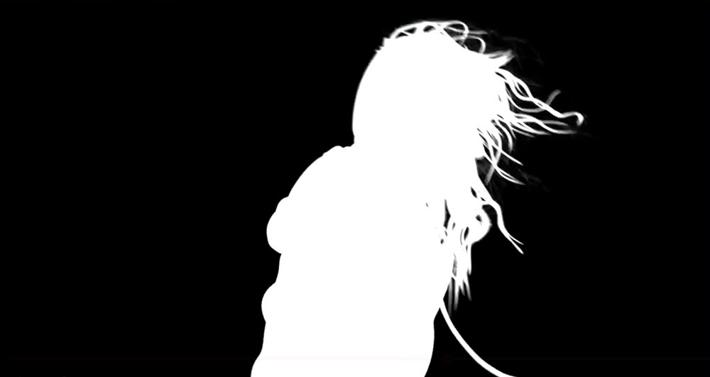 The alpha channel of the wind plate: a white silhouette on black, with fine hair strands resolved in the matte.
